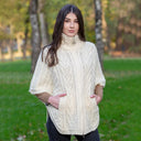 
A10014 NATURAL WHITE Colour Aran Funnel Neck Poncho Jacket Lifestyle Gaelsong
