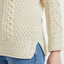 A20243 NATURAL WHITE Colour Traditional Irish Roll Neck Sweater Closeup Sleeve View Gaelsong